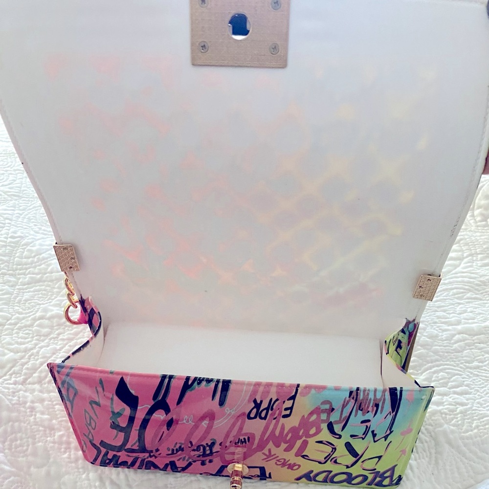 New Caleesa graffiti jelly fold over flap crossbody bag with gold tone hardware. - Picture 3 of 3
